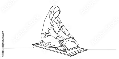 A continuous line drawing of a muslim woman folding her prayer mat after finishing her daily prayer