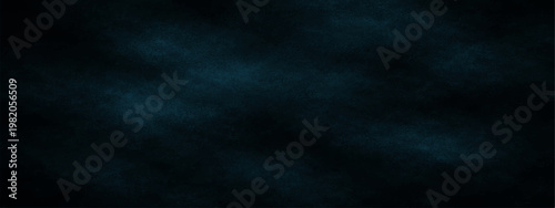 Abstract moody dark shades of blue, the image showcases a captivating atmosphere with textures that evoke depth and mystery. A visual exploration of contrasts and tonal variations.