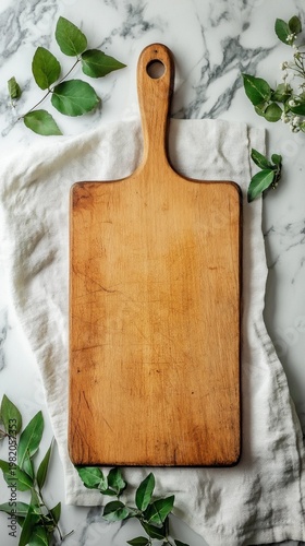 A wooden chopping board adorned with greenery exudes a natural feel, creating an inspiring backdrop for the home kitchen.