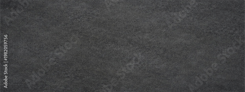 Abstract a close-up texture photograph captures a minimalist, textured stone surface, displaying the subtle variations and patterns found in natural materials.