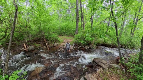 Man Crossing Creek and Putting Away Pole in Shenandoah National Park