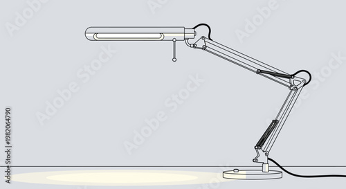 Functional grey adjustable desk lamp or architect lamp shining a warm light on the surface below against a neutral background.