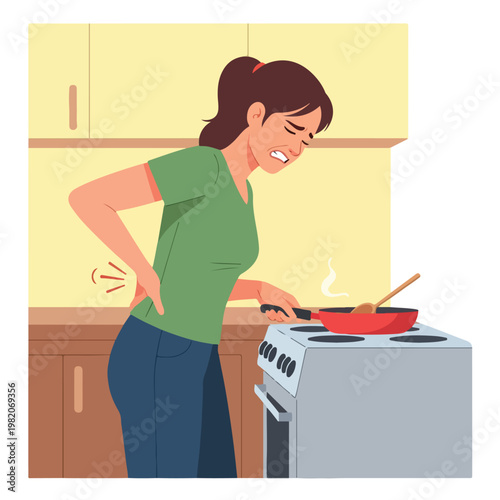 A woman grimacing in pain while holding her back while cooking in the kitchen