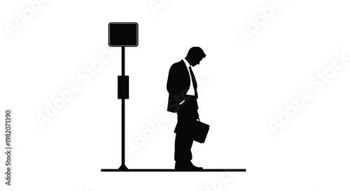 Silhouette of a businessman standing sadly by a street sign