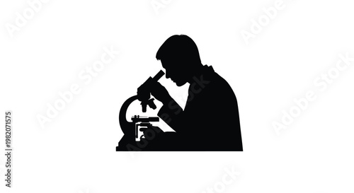 Silhouette of a scientist intently working with a laboratory microscope