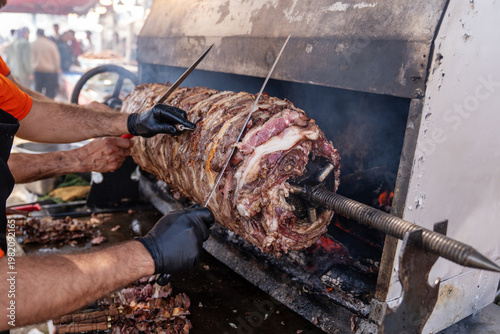 Traditional Erzurum Cag Kebab Cooking on Horizontal Rotisserie Grill