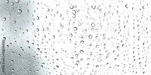 A close up view of numerous rain droplets scattered across a transparent glass surface background