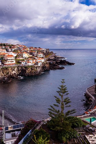 Porto de Câmara de Lobos harbor, Câmara de Lobos Madeira Portugal colorful fishing port and coastal village on Atlantic shoreline.
