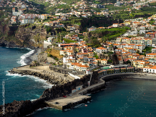 Porto de Câmara de Lobos harbor, Câmara de Lobos Madeira Portugal colorful fishing port and coastal village on Atlantic shoreline.