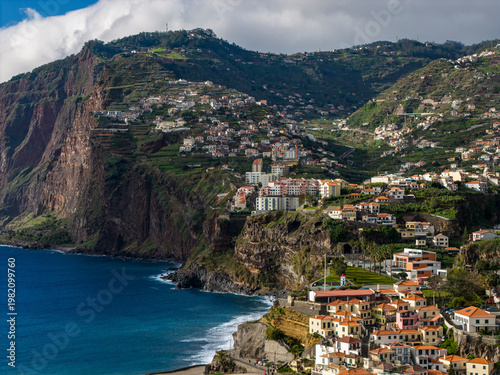 Porto de Câmara de Lobos harbor, Câmara de Lobos Madeira Portugal colorful fishing port and coastal village on Atlantic shoreline.