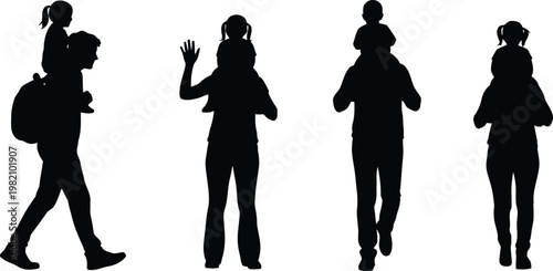 Silhouette of people walking with child on shoulders