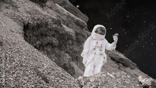 Wallpaper Mural Astronaut in white space suit on moon surface with bright star light and dark space background Torontodigital.ca