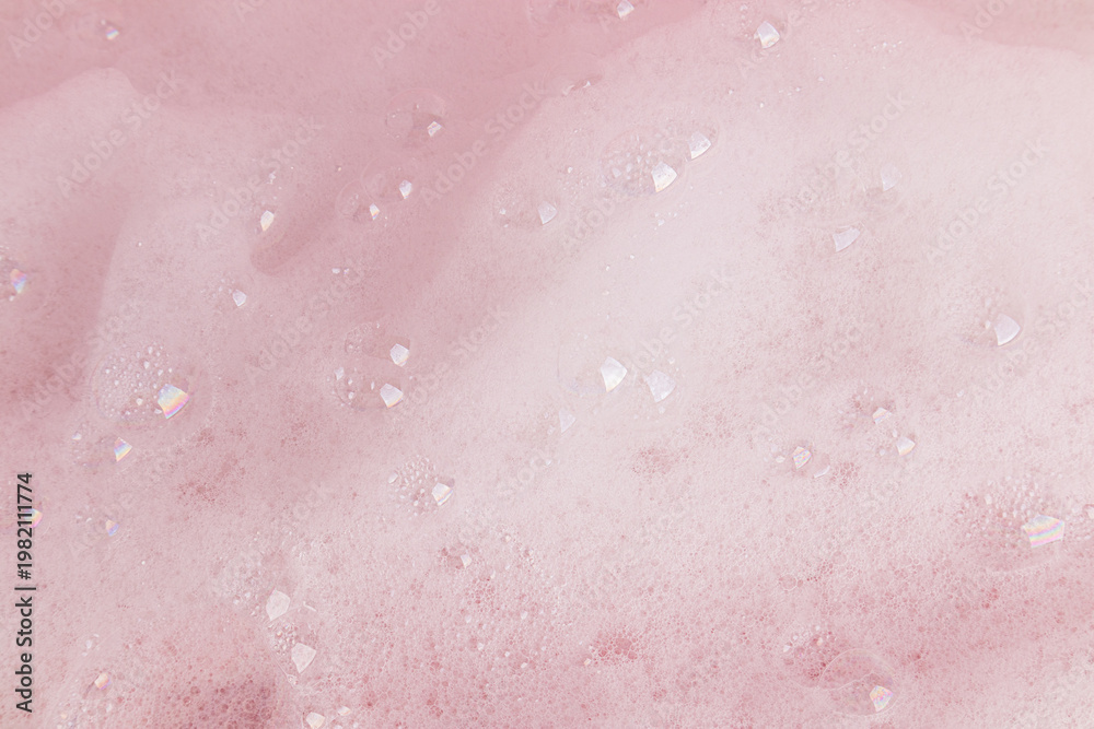 Fototapeta premium Beautiful abstract soapy texture background with white foam bubbles. Texture of shower gel, shampoo, detergent. small transparent bubbles. top view.