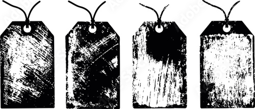 Set of four vintage distressed hanging tags with string, grunge textured labels for design and decoration