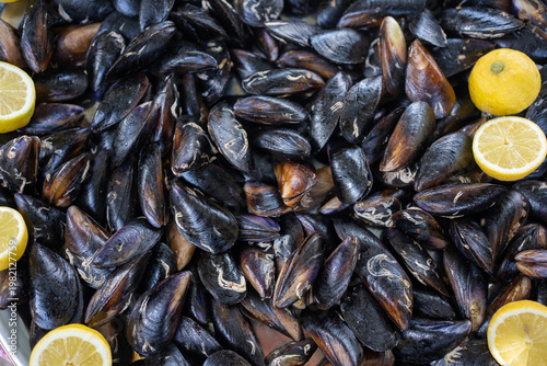 Fresh Mussels with Lemon Slices Background Seafood Texture