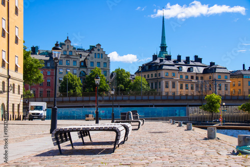Photography Empty benches on cobblestone square in Gamla Stan, Stockholm, Sweden