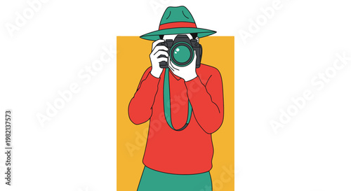 Person wearing a hat and holding a camera, ready to take a picture.