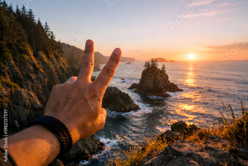 Hands resting on rocks by the ocean at sunset on a peaceful beach
