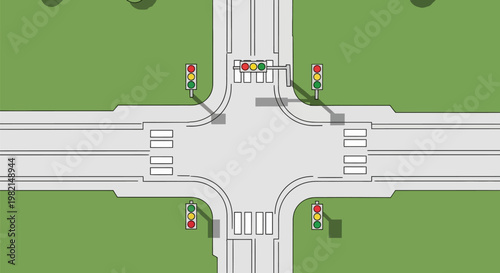 Aerial view of a four way road intersection.