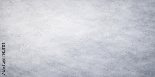 Abstract blue sky with fluffy white clouds and a grunge paper texture background creates a weathered winter atmosphere