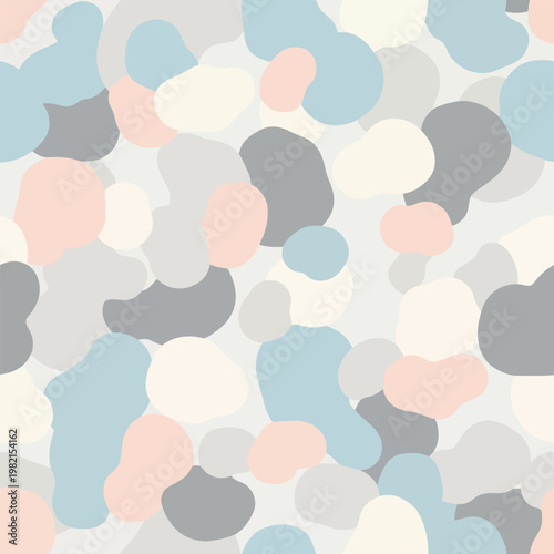 A colorful abstract composition of various shapes and sizes scattered across a plain surface