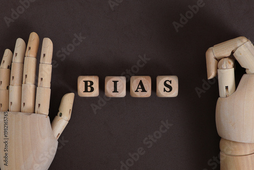 Cognitive Bias Concept Illustrated with Wooden Mannequin Hands and Decision-Making Influence