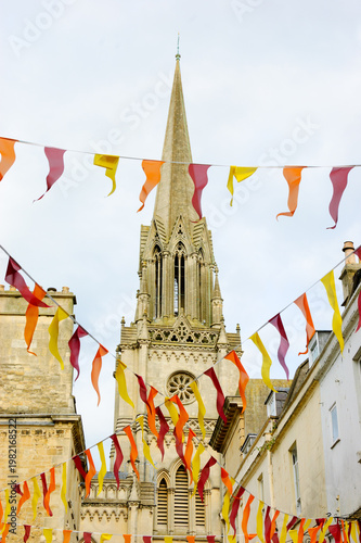 St Michael's Church and festive flags in city of Bath  known for its Roman-built baths. Somerset, England, UK.