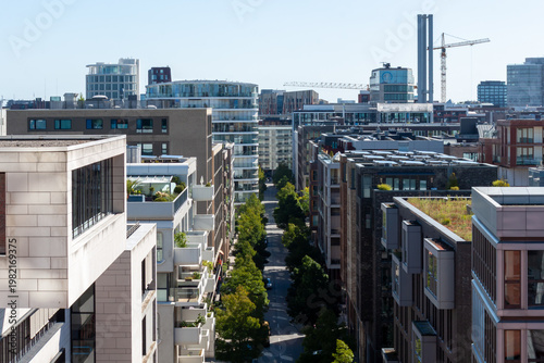 Aerial view of modern residential architecture and green streets in the Hafencity district under a clear sky, Hamburg