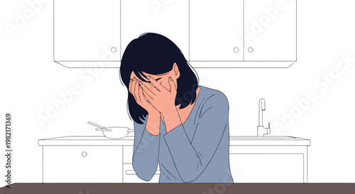 A young woman crying and covering her face with both hands in a modern kitchen