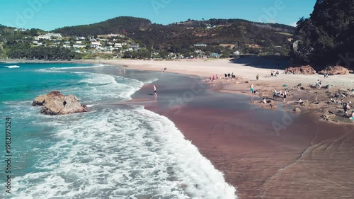 Hot Water Beach in the Coromandel Peninsula, aerial view in slow motion, New Zealand