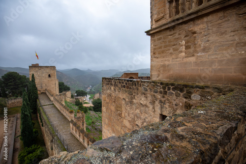 View of the Alcazaba of Antequera, Malaga, Andalusia, Spain, with its walls and towers on a cloudy day