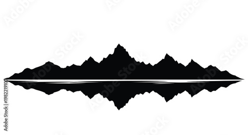 Silhouetted mountain range and its reflection in calm water