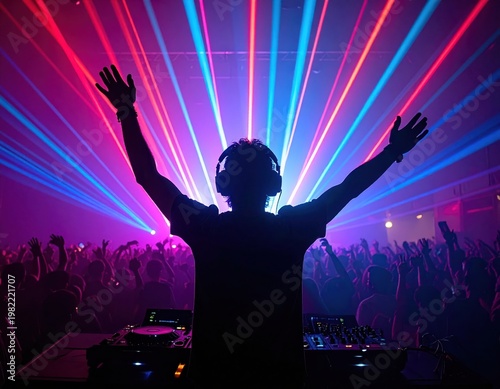 Energetic DJ with raised arms performing at music festival with colorful laser lights