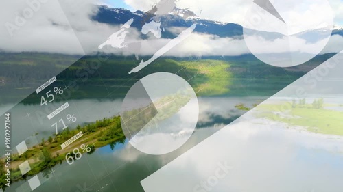 Drone gliding over lake toward spit, starting tech charts growing, hiding, fading, revealing land