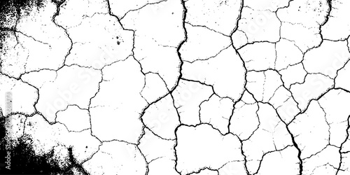  grunge texture of a cracked, weathered concrete wall in black and white monochrome. surface features intricate fracture patterns spreading organically across aged plaster.