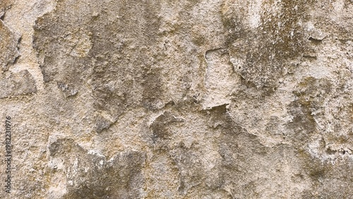 Weathered, rough concrete wall texture with peeling render and earthy tones, showcasing decay and grunge.