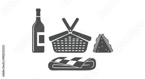 A wine bottle with a picnic basket and food