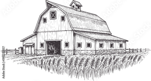 Vintage barn with stone foundation surrounded by wheat field and wooden fence