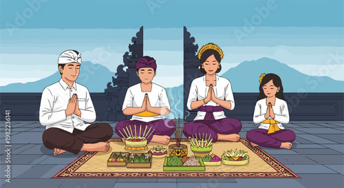 Balinese family in traditional dress praying with sacred offerings at the temple