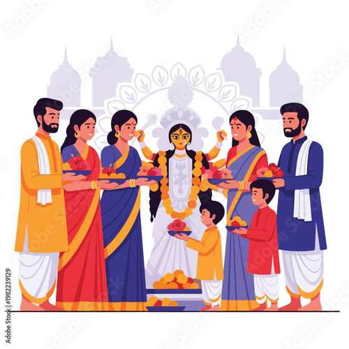Hindu family in traditional dress celebrating Durga Puja festival with offerings
