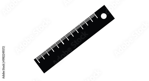 A black ruler with metric markings is diagonally positioned against a white background high quality professional