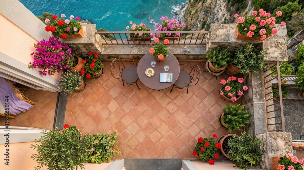 Obraz premium Aerial terrace courtyard with round table chairs and flowering pots for outdoor patio background and travel banner