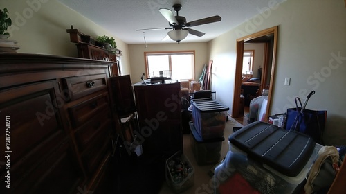 Decluttering Activity in a Living Space With Many Boxes and Furniture in Disarray