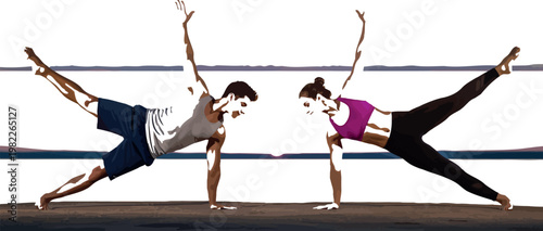 Fit man and woman perform a challenging side plank yoga pose while balancing together during a beautiful golden sunset by the calm water in nature