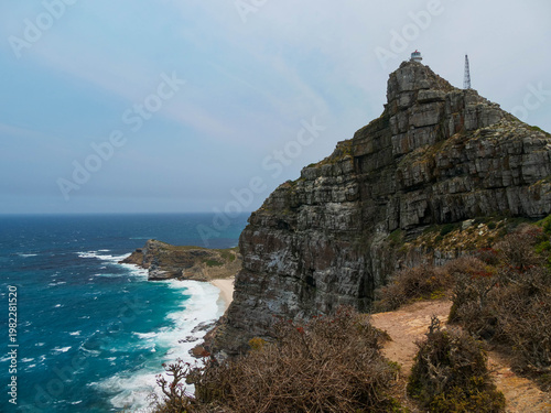 Path or walkway to the view point of the old red and white lighthouse located at Cape Point, part of Table Mountain National Park, Cape Town, South Africa, a popular tourist and travel destination.