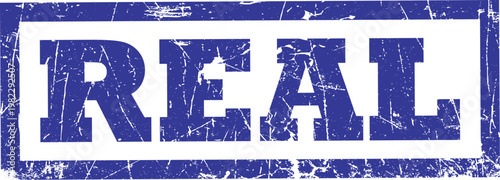 Blue grunge rubber stamp impression with the word real inside a rectangular border