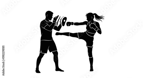 Silhouette of woman practicing kickboxing with focus mitts.