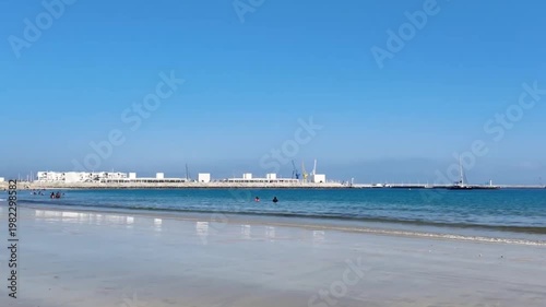 Tangier Beach Morocco Pan from Port to Sea with Football Activity Ocean Waves and Summer Lifestyle Scene