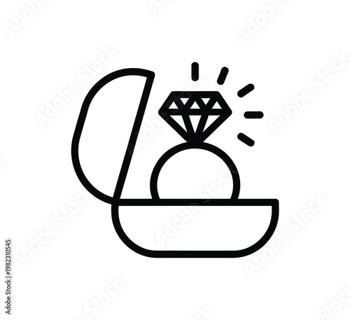 Diamond ring sits in an open gift box.