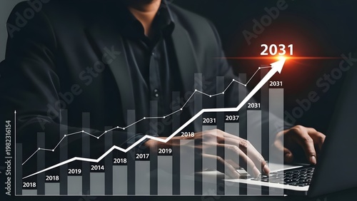 Businessman analyzes a rising financial graph overlayed on his laptop, projecting substantial market growth towards 2031.